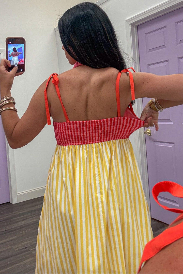 yellow and pink vertical striped sleeveless smocked back midi dress